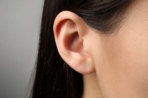 Close-up of a woman's ear before cosmetic ear surgery